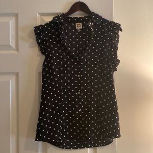 Black & white sleeveless blouse with pearl buttons